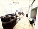 Comfortable living room with abundant natural light, leading to the dining area at 6819 Mahogany Meadows Ave, Las Vegas, NV 89122