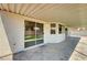 Covered patio with low-maintenance landscaped backyard and sliding glass door at 689 Hitchen Post Dr, Henderson, NV 89011