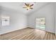 Bedroom with wood-look flooring and sliding glass doors to the backyard at 689 Hitchen Post Dr, Henderson, NV 89011