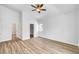 Light, bright bedroom with wood-look floors, ceiling fan, walk in closet and neutral paint palette at 689 Hitchen Post Dr, Henderson, NV 89011