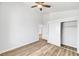Clean bedroom with wood-look flooring and closet with clothing rod at 689 Hitchen Post Dr, Henderson, NV 89011