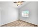 Bright bedroom with wood-look flooring and a ceiling fan for added comfort at 689 Hitchen Post Dr, Henderson, NV 89011