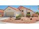 Charming single-story home showcasing manicured desert landscaping at 689 Hitchen Post Dr, Henderson, NV 89011