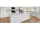 Close up of the kitchen island with quartz countertops and modern finishes, bright interior at 689 Hitchen Post Dr, Henderson, NV 89011
