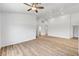 Spacious living room featuring wood floors, ceiling fan and light bright interior at 689 Hitchen Post Dr, Henderson, NV 89011