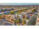 Aerial view of a home with manicured landscaping and palm trees in a suburban neighborhood at 6971 Cedar Basin Ave, Las Vegas, NV 89142