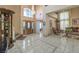 Grand foyer with high ceilings, elegant chandelier, staircase, and ornate furnishings at 6971 Cedar Basin Ave, Las Vegas, NV 89142