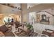 Spacious living room with high ceilings, tile flooring, and elegant furnishings at 6971 Cedar Basin Ave, Las Vegas, NV 89142