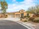 Charming one-story home with a well-manicured lawn, three-car garage, and beautiful desert landscaping at 6982 Mirkwood Ave, Las Vegas, NV 89178