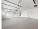 Spacious garage featuring clean epoxy floors, ample lighting, and utility connections at 6982 Mirkwood Ave, Las Vegas, NV 89178
