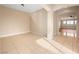 Large open living area with tile floors and neutral color scheme at 6982 Mirkwood Ave, Las Vegas, NV 89178