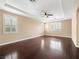 Spacious main bedroom features dark wood floors, ample natural light, and tray ceiling at 6982 Mirkwood Ave, Las Vegas, NV 89178