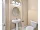 Powder room features a pedestal sink and updated fixtures at 6982 Mirkwood Ave, Las Vegas, NV 89178