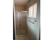 Bathroom features a standup shower with a chrome shower door and a chrome towel rack at 709 Scholl Dr, Las Vegas, NV 89107