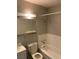 Basic bathroom with standard fixtures including a toilet, sink, and a shower-tub combination at 709 Scholl Dr, Las Vegas, NV 89107
