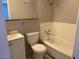 Standard bathroom with a combined shower and tub, toilet, and a vanity sink at 709 Scholl Dr, Las Vegas, NV 89107