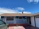 Single story exterior featuring blue siding, red brick base, and a well-maintained roof at 709 Scholl Dr, Las Vegas, NV 89107