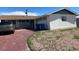 Exterior shot showcasing a garage, blue trash cans, and desert landscaping at 709 Scholl Dr, Las Vegas, NV 89107