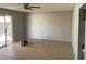 Open living area with tile floors and natural light from sliding glass door to patio at 709 Scholl Dr, Las Vegas, NV 89107