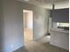 View from kitchen through to living area. Refrigerator visible on the right side of frame at 709 Scholl Dr, Las Vegas, NV 89107