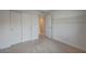 Bedroom featuring light grey walls, white trim and doors, neutral carpeting and closet at 757 Omaggio Pl, Henderson, NV 89011