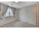 Bedroom with neutral walls, carpeting, white trim and curtained window at 757 Omaggio Pl, Henderson, NV 89011