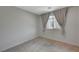 Neutral bedroom with one window dressed with gray curtains and neutral carpeting at 757 Omaggio Pl, Henderson, NV 89011