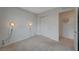 Bedroom featuring light grey walls, modern lighting fixtures, white trim and neutral carpeting at 757 Omaggio Pl, Henderson, NV 89011
