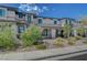 Beautiful townhome featuring desert landscaping, a well-maintained facade, and stone accents in a desirable community at 757 Omaggio Pl, Henderson, NV 89011