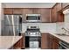 Well-equipped kitchen featuring stainless steel appliances, solid surface countertops, and ample storage space at 757 Omaggio Pl, Henderson, NV 89011