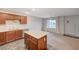 Contemporary kitchen connected to living area with island and modern appliances, great for entertaining guests at 757 Omaggio Pl, Henderson, NV 89011