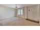 Cozy living room with neutral carpeting and a bright window, providing a welcoming atmosphere for residents at 757 Omaggio Pl, Henderson, NV 89011