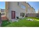 Backyard featuring lush turf, a barbecue and brick pavers for outdoor enjoyment at 7953 Mountain Lilac St, Las Vegas, NV 89113