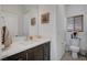Clean and modern powder room with stylish vanity, mirror, and fixtures at 7953 Mountain Lilac St, Las Vegas, NV 89113