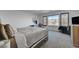 Bright bedroom with a large window and neutral decor for a relaxing atmosphere at 7953 Mountain Lilac St, Las Vegas, NV 89113