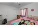 Bedroom with a pink Disney themed bedspread, dresser, and closet at 7953 Mountain Lilac St, Las Vegas, NV 89113