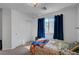 Bedroom featuring blue drapes, twin bed, and a closet at 7953 Mountain Lilac St, Las Vegas, NV 89113
