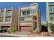 Modern three-story home boasting a roof deck, balcony, two-car garage, and desert landscaping at 7953 Mountain Lilac St, Las Vegas, NV 89113