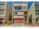 Modern three-story home boasting a roof deck, balcony, two-car garage, and desert landscaping at 7953 Mountain Lilac St, Las Vegas, NV 89113