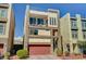 Modern three-story home boasting a roof deck, balcony, two-car garage, and desert landscaping at 7953 Mountain Lilac St, Las Vegas, NV 89113
