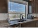 Bright kitchen features a beautiful view and ample space for meal preparation and gatherings at 7953 Mountain Lilac St, Las Vegas, NV 89113