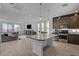 Open-concept kitchen with an island flowing seamlessly into the living area, perfect for entertaining at 7953 Mountain Lilac St, Las Vegas, NV 89113