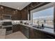 Well-lit kitchen with granite countertops, stainless steel appliances, and a large window for scenic views at 7953 Mountain Lilac St, Las Vegas, NV 89113