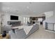 Spacious living room featuring modern fireplace, plush seating, and seamless flow into the dining and kitchen areas at 7953 Mountain Lilac St, Las Vegas, NV 89113