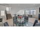 Open-concept floor plan with living, dining, and kitchen areas, and staircase at 7953 Mountain Lilac St, Las Vegas, NV 89113