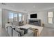 Bright living room with large windows, plush seating, contemporary fireplace, and stylish decor at 7953 Mountain Lilac St, Las Vegas, NV 89113