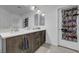 Bright bathroom with dual sink vanity, wood cabinets, and updated finishes at 7953 Mountain Lilac St, Las Vegas, NV 89113