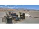 This roof deck features stunning views and stylish outdoor furniture at 7953 Mountain Lilac St, Las Vegas, NV 89113