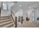 Bright staircase with modern railing leads to the upstairs with a conveniently located, tiled bathroom at 7953 Mountain Lilac St, Las Vegas, NV 89113