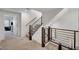 Modern staircase with metal railings and carpeted steps leading to the upper levels of the home at 7953 Mountain Lilac St, Las Vegas, NV 89113